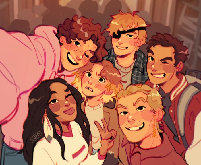 The friends crammed together taking a selfie